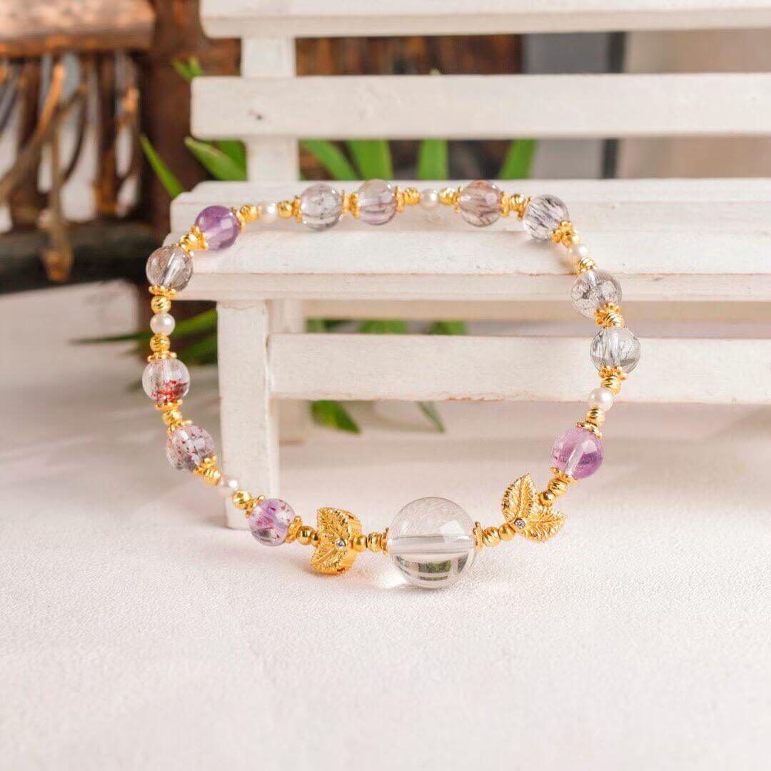 Luminous Aura: Faceted Super Seven, Garnet & Clear Quartz Goldfish Bracelet BodhiBloom