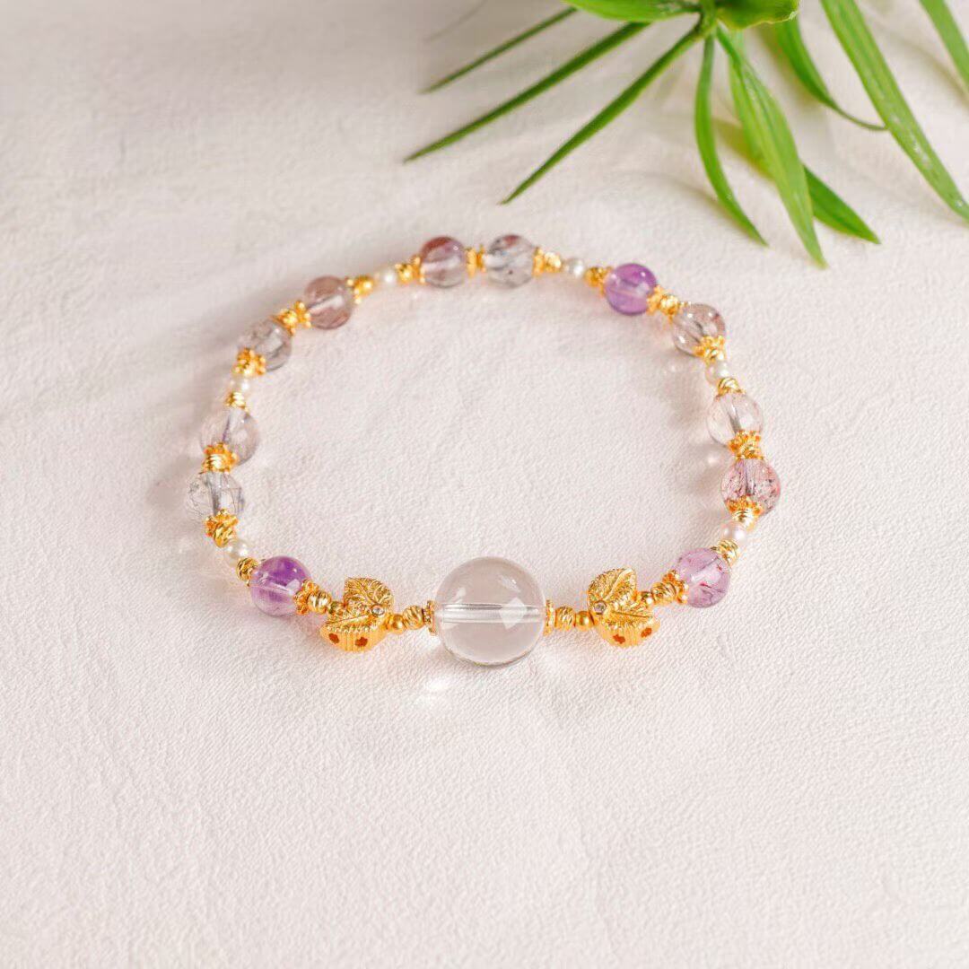 Luminous Aura: Faceted Super Seven, Garnet & Clear Quartz Goldfish Bracelet BodhiBloom