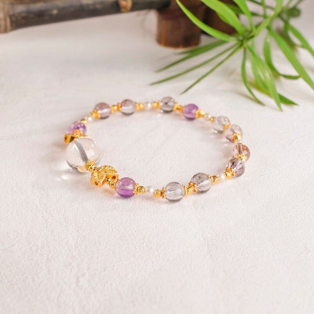 Luminous Aura: Faceted Super Seven, Garnet & Clear Quartz Goldfish Bracelet BodhiBloom